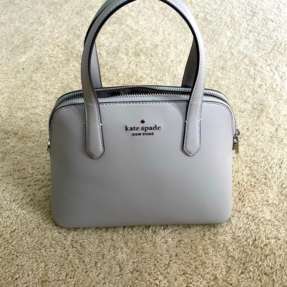 Grey Kate Spade dome crossbody purse. New with tags.